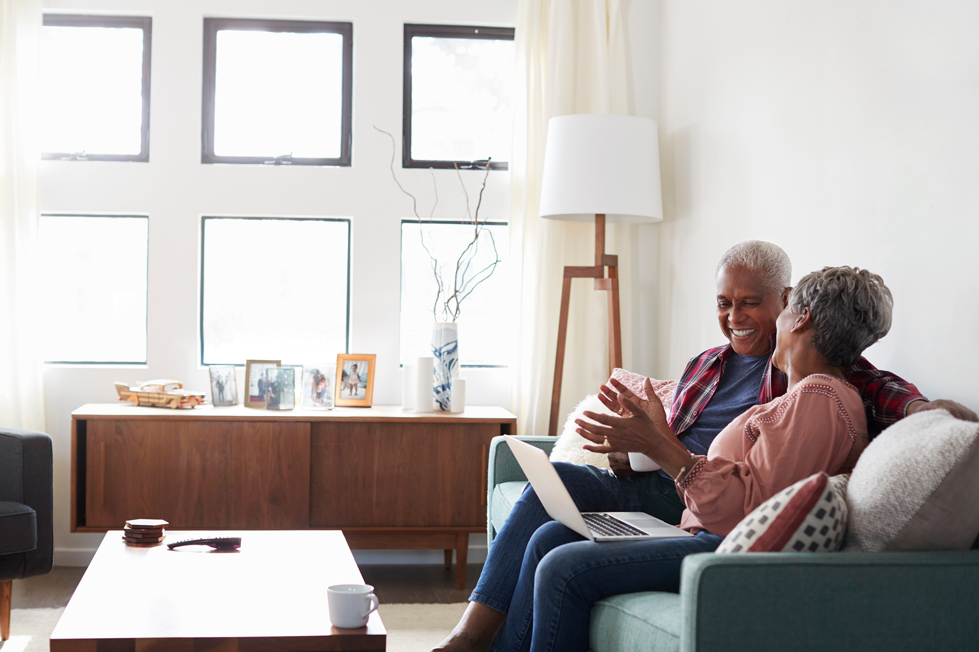 retired couple looking at laptop together